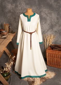 The dress has simple medieval cut with long sleeves, loose and comfortable. The historical pattern - an important element when playing historical realities, especially Vikings or Slavs. Put on your cloak and travel back to the Middle Ages. Hunting, ancient legends, the warmth of the hearth and our dress will give you an unforgettable experience. The simple cut of the dress allows you to move freely, as well as boldly add accessories to the dress. The dress will perfectly fit into the basic wardr Fall Medieval Dress With Long Sleeves, Long Sleeve Medieval Dress With Historical Design For Fall, Fall Medieval Dress With Historical Design, Long Sleeve Medieval Dress With Historical Design For Festivals, Viking Style Long Sleeve Medieval Dress For Festivals, Long Sleeve Medieval Dress With Historical Design, Traditional Long Sleeve Dresses For Medieval Festivals, Long Sleeve Dresses For Medieval Festivals, Viking Style Medieval Dress With Long Sleeves