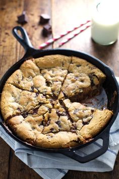 a chocolate chip cookie in a cast iron skillet