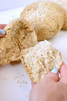 a person is holding a cookie in their left hand and the other half has powdered sugar on it