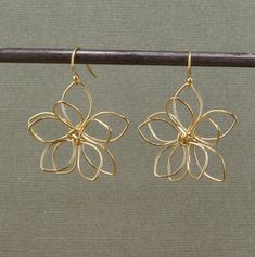 Gold Wire Wrapped Flowers on gold filled ear wires - Gold plated brass flowers - Flowers measure 32mm   - Gold Filled Wires - Lightweight and Comfortable Here is the link to the identical earrings in silver instead of bronze: https://mosaicsunstudio.etsy.com/listing/1648730710 Wire Wrapped Flower Earrings, Cute Wire Earrings, Butterfly Wire Earrings, Gold Wire Earrings, Flower Wire Earrings, Gold Flower-shaped Earrings For Wedding, Gold Flower Pendant Earrings For Wedding, Brass Flower Charm Earrings, Nickel-free Brass Flower-shaped Earrings