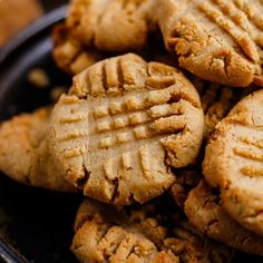 a plate full of peanut butter cookies on a table