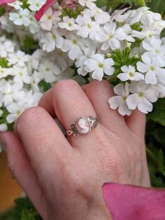 An enchanting sterling silver cameo ring that features a classic portrait of a vintage lady. Version 1 has the cameo set in a bezel setting with beautiful scrollwork detailing and a heart cutout on each shoulder of this show-stopping ring. Version 2 has a prong-set cameo flanked by a delicate cross-over design. SIZE: This ring is adjustable, which is convenient if you aren't sure what size your recipient's finger is or if you like wearing rings on different fingers. To resize the ring, simply sl White Cameo Rings For Wedding, White Cameo Wedding Rings, Silver Cameo Ring For Anniversary, Silver Cameo Rings For Wedding, Silver Cameo Wedding Rings, Victorian Silver Cameo Rings, Sterling Silver Cameo Jewelry For Anniversary, Sterling Silver Cameo Jewelry For Gift, Silver Cameo Jewelry For Anniversary