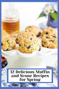 blueberry muffins and some berries on a plate with honey in the background