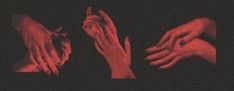 three hands reaching for each other with red light in the dark behind them and black background