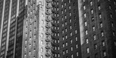 black and white photograph of tall buildings in new york city