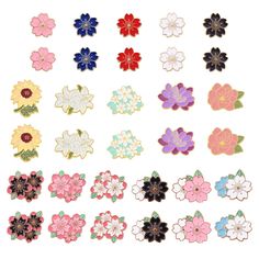 an assortment of flower shaped pins