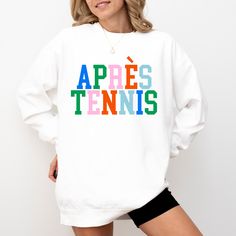 Après Tennis Sweatshirt I love to help my customers with custom orders, if you have a specific request (adding team or club name, bachelorette party personalization, a different sweatshirt color, design on a shirt, or a swap to a Comfort Colors sweatshirt), please message me and I will promptly get back to you! This is a Gildan Sweatshirt with a UNISEX FIT. Please review the size chart in the images before you place your order. If you have any questions about sizing, I would be happy to help! If White College Sweatshirt With Screen Print, White Custom Print School Spirit Sweatshirt, White Custom Print Sweatshirt For Sports Events, White School Spirit Sweatshirt With Custom Print, School Spirit White Sweatshirt With Custom Print, College Crew Neck Sweatshirt With Custom Print, White Relaxed Fit Sweatshirt With Team Spirit, White Relaxed Fit Sweatshirt For Team Spirit, Varsity Crew Neck Top With Custom Print