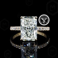 an engagement ring with a cushion cut diamond in the center