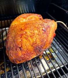 the meat is being cooked on the grill