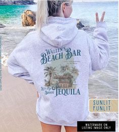 Get ready for the beach vibes with our Wallen Hoodie Sweatshirt, featuring our original Wallen's Beach Bar design inspired by Sand In My Boots. This hoodie is a country music shirt perfect for a concert or a day at the beach. Whether you're a music lover or just love the aesthetic of beach song lyrics, this hoodie is a fantastic choice for both style and comfort. **Also available in Comfort Colors garment dyed tee, see separate listing in our shop SIZING - please read 😊 *This is a 50/50 cotton Cotton Hoodie For Summer Vacation, Casual Beach Hoodie Top, Relaxed Fit Hooded Beach Tops, Summer Vacation Cotton Hoodie, Relaxed Fit Hooded Tops For Beach, Relaxed Fit Sweatshirt For Beach Season Streetwear, Trendy Summer Beach Hoodie, Hoodie Sweatshirt For Summer Vacation, Trendy Summer Hoodie With Crew Neck