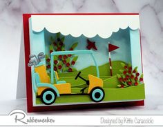 a handmade card with a golf cart on the grass and trees in the background