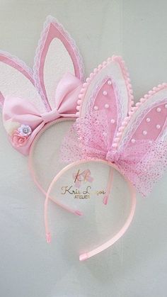 a pink and white bunny ears headband