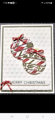 a close up of a christmas card on a cell phone