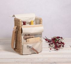 a wicker basket filled with items sitting on top of a wooden floor