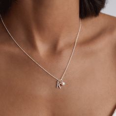 Our Initial and Pearl Drop Necklace is the perfect personalised gift for someone special. Featuring a genuine freshwater pearl and solid sterling silver initial letter, our necklace compliments any outfit. Beautifully handcrafted in our London studio, this dainty design is made to last a lifetime. Our necklaces now come with an extendable 16-18inch (41cm-46cm) chain as standard, which is perfect for layering, or you can upgrade to our 20inch chain. (please note this is not extendable). Available Classic Silver Initial Pendant Chain Necklace, Silver Chain Necklace With Initial Pendant As Gift, Dainty Silver Initial Pendant Chain Necklace, Silver Initial Pendant Chain Necklace, Silver Necklace With Initial Pendant And Pearl Charm, Gold Letter Pendants, Initial Necklace Silver, Personalised Necklace, Pearl Drop Necklace