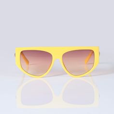 Ebullient adds a vivid pop of color and style to your look. Its eye-catching bright yellow frame, flat top, and gradient lens give you the versatility of a classic pair of shades and enough personality to stand out in any crowd. 100% UVA UVB protection Sizing Front Frame: 152 mm Lens width: 67 mm Bridge: 21 mm Yellow Tinted Aviator Sunglasses For Summer, Yellow Aviator Sunglasses With Gradient Lenses For Summer, Summer Yellow Tinted Aviator Sunglasses, Casual Yellow Tinted Aviator Sunglasses, Casual Yellow Aviator Sunglasses With Tinted Lenses, Retro Yellow Sunglasses With Gradient Lenses, Trendy Yellow Polarized Aviator Sunglasses, Trendy Yellow Aviator Sunglasses With Polarized Lenses, Casual Yellow Shield Sunglasses With Tinted Lenses