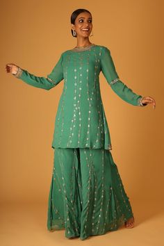 Green georgette kurta with all over hand embroidery. Paired with a coordinating sharara and dupatta with contrast embroidered border using dori and aari work. - Aza Fashions Bollywood Style Georgette Sharara For Reception, Georgette Kurta For Reception, Georgette Palazzo Set With Mirror Work, Reception Palazzo Set With Straight Kurta In Georgette, Georgette Palazzo Set With Dabka Work For Reception, Georgette Sharara For Reception In Transitional Season, Georgette Palazzo Set With Zari Work For Reception, Festive Georgette Sharara With Cutdana Details, Festive Designer Georgette Sharara