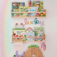 two wooden shelves filled with books and toys