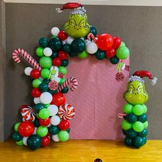 an arch made out of balloons and candy canes