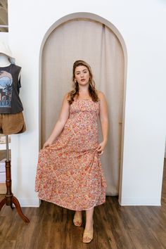 This breezy floral midi dress will have you flowing through your day in satiny textured voile. Featuring a square neckline, smocked bodice, and beautifully the flowy, tiered skirt, this dress is perfect for all of your summer activities! This dress can even be made a little more casual with a pair of sandals and lightweight sweater. floral midi dress adjustable straps smocked bodice tiered skirt straight neckline fits true to size, model wears size medium 52% cotton, 48% rayon hand wash cold, ha Summer Maxi Dress With Ruched Bodice And Square Neck, Flowy Smocked Midi Sundress, Flowy Sundress Smocked Midi Dress, Flowy Smocked Bodice Midi Dress, Flowy Midi Smocked Sundress, Flowy Midi Sundress For Brunch, Square Neck Floral Midi Dress For Daywear, Ditsy Floral Sundress Midi Dress For Daywear, Flowy Midi Sundress With Smocked Back