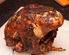 a piece of meat sitting on top of a white plate