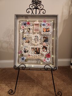 a photo frame with pictures and lights on it