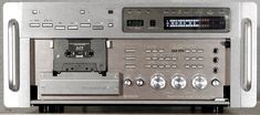 an old fashioned stereo is shown with buttons and other electronic equipment on it's side