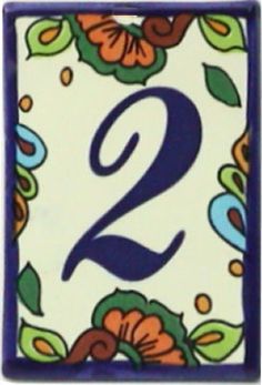 the number two is decorated with colorful flowers and leaves on white background, blue border