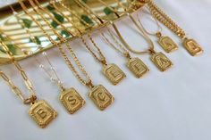 ❤︎ 18K Gold Initial Letter WATERPROOF Necklace, Medal Gold Letter Initial Pendant Necklace, Square Alphabet Rectangle Medallion Pendant, Unisex ❤︎ 🌟...A B O U T...T H I S...I T E M... 🌟 ◾️ ~~Lead-free and Nickel-Free, a great choice for sensitive skins. ◾️ ~~Hypoallergenic. ◾️ ~~Tarnish-Free and our jewelry WILL NOT turn your skin black or green. ◾️ ~~Affordable, high-quality everyday wear jewelry. ...M A T E R I A L... ~~ Pendant length: 24MM x width 16MM. ~~ All Chains & Pendants Materia Gold Rectangular Necklace For Anniversary, Rectangular Gold Necklaces For Gifts, Square Gold Necklace For Everyday, Everyday Square Gold Necklace, Dainty Gold Square Jewelry, Square Gold Jewelry Gift, Square Gold Jewelry For Gifts, Handmade Gold Necklace With Rectangular Shape, Personalized Rectangular Gold Jewelry