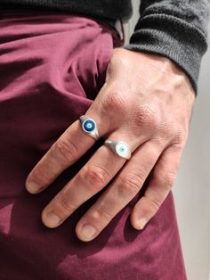 Evil eye ring. Its hand painted in 2 colors, the traditional blue or the elegant white! * You can pick between 925 silver plated or 24k gold plated. Everything is handmade from the scratch with love and care. All the parts are nickel free and antiallergic .. * 2 adjustable sizes! 1)Rings Diameter is 17mm (0.67'') - US 7 Dimensions 19,9x16,5 mm (0.78''x 0.70') 2)Rings Diameter is 20mm (0.78'') - US 10 Dimensions 19,9x16,5 mm (0.78''x 0.70') Evil eye meaning The evil eye brings good luck and prote Handmade White Signet Ring, Handmade Symbolic White Rings, Symbolic Handmade White Rings, Blue Spiritual Ring With Evil Eye, Spiritual Blue Ring With Evil Eye Detail, Spiritual Blue Rings With Evil Eye Detail, Spiritual Blue Evil Eye Ring, Adjustable Symbolic Blue Rings, Symbolic Adjustable Blue Rings