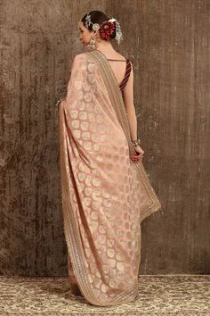 Baby pink georgette woven saree with all ornamental booti placement pattern, border in dori, badla and kasab work. Paired with maroon silk chanderi princess cut blouse with all over gota work and Hyderabad micro pearls embroidery.
Component: 2
Pattern: Embroidered and Embellished
Type Of Work: Gota, Badla, Kasab, Dori Work and Hyderabadi Micro Pearls
Neckline: Round
Sleeve Type: Sleeveless
Fabric: Saree: Georgette, Blouse: Silk Chanderi, Lining: Taffeta Silk
Color: Pink
Other Details: 
Blouse: D Pre-draped Saree For Puja Festivals, Designer Georgette Pre-draped Saree With Zari Weaving, Designer Wear Pre-draped Saree With Zari Work, Pre-draped Saree For Designer Wear At Eid, Transitional Traditional Wear With Zari Work, Transitional Season Pre-draped Georgette Saree, Eid Pre-draped Saree With Self Design, Gold Pre-draped Chinon Saree, Pre-draped Saree For Eid