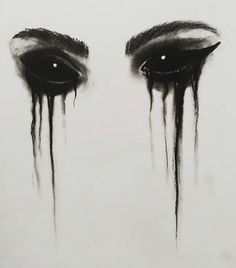 an eye with dripping black paint on it