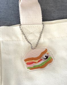 a white bag with a cartoon sandwich on it