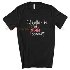 I'd Rather Be At a P!nk Concert T-Shirt  P!nk Tee T-Shirt Brand: Bella+Canvas -4.2 oz., 100% airlume combed and ringspun cotton -Shoulder taping -Side-seamed -Retail fit -Pre-shrunk -Unisex sizing - For the best fit, we recommend that you compare the measurements given on our size chart to the measurements of your most comfortable tee. All shirts are made to order therefore we do not accept returns/exchanges. P!nk Pink summer carnival 2023 shirt #Trustfall #PinkTee  #TheSingerPink #FanArtLogo #ConcertMerchandise #SummerCarnivalTour #TrustfallAlbum #NotDanceAgain #GiftForHimOrHer #IdRatherBeAtA #MusicT-Shirt #FunnyConcertTee #GiftForFriend #LiveMusicTshirt #RockAndRollBand #Pink #Aleciabethmoore #Aleciamoore #pinktour #pinktour2023 #pinklive2023 #summercarnival #summercarnivaltour #summerca Pink Punk T-shirt For Summer, Pink Punk T-shirt With Letter Print, Band Merch Slogan Tops For Concerts, Band Merch Tops With Slogan For Concert, Pink Screen Print Top For Concert, Pink Punk Style Summer T-shirt, Kpop Style Tops With Screen Print For Concerts, Kpop Style Screen Print Tops For Concert, Pink Kpop Tops With Graphic Print