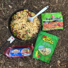 some food is laying out on the ground next to it's bag and spoon