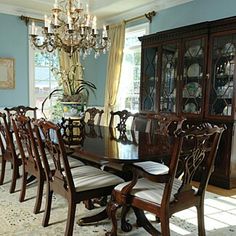 a dining room table with many chairs around it