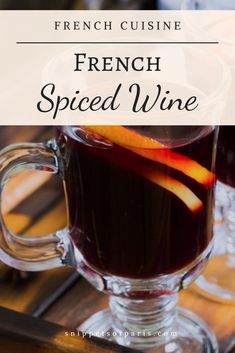 french spiced wine in a glass mug on a wooden table with text overlay