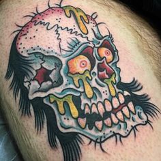 a man with a skull tattoo on his thigh