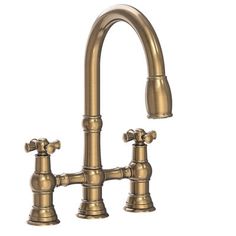 an antique style kitchen faucet with two handles and nozzles on the side