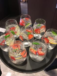 several glasses filled with different types of drinks