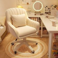 a white chair sitting on top of a wooden floor in front of a desk with a mirror