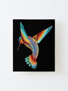 a colorful hummingbird flying in the air with its wings spread out, on a black background