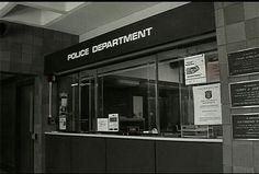 the police department is located in an office building with signs on the front and side walls