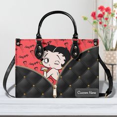 Betty Boop Leather Handbag,Betty Boop Lover's Handbag,Custom Leather Bag,Woman Handbag,Handmade Bag,Vintage Bag,Betty Boop Women Bags Purses Product Information: Manufactured with premium water-resistant PU leather. Size: ~11.4*7.9*4.1in (29*20*10.5 cm). Features comfortable and sturdy ~29in (74cm)carrying straps, two handles~14,5in (37cm) high-quality stitching for long-lasting durability. Perfect for dating, shopping, working, traveling, vocation, party and other occasions. Well made of high quality metal buckle. Detailed stitching with smoothly metal buckle. Handbags have 1 main compartment, and one side pocket - you can use it for an extra pocket. This handbag can hold your iPad, wallet, makeup, phone, little water bottle, perfumes, gloves, and other everyday items and keep them organi Leather Bag Women Handbags, Betty Boop Handbags, Betty Boop Purses, Custom Leather Bag, Woman Handbag, Denim Handbags, Vintage Bag, Handmade Bag, Leather Bag Women