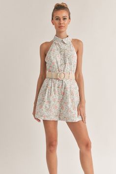 Embrace the bloomy side of life with our Floral Print Romper with Belt. This versatile design is your ticket to a stylish and comfortable look this summer. With a stunning floral print that exudes freshness, a flattering halter neckline, and a belt to cinch around the waist, this romper is a must-have in your wardrobe. Stay organized and stylish with convenient pockets to store your essentials while you take on your next adventure. Unleash your wild side and live life to the fullest in this chic Chic Floral Print Halter Top For Day Out, Chic Spring Vacation Halter Top, Chic Spring Halter Top For Vacation, Sleeveless Floral Print Halter Top For Spring, Feminine Spring Vacation Halter Top, Feminine Halter Top For Spring Vacation, Spring Floral Print Fitted Halter Top, Floral Print Fitted Halter Top For Spring, Fitted Floral Print Halter Top For Spring