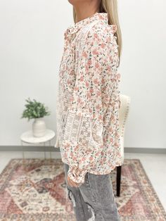 The Blushing For You blouse is a flirty and feminine addition to your wardrobe. Featuring a soft blush floral print and mixed lace insets, this blouse is effortlessly chic and elegant. The relaxed fit and open back details with a cinching tie add a playful touch to this must-have piece. Get ready to turn heads and blush for all the right reasons! Oversized fit - Size down Model is 5'4 and wearing a small 100% Polyester Spring Pink Tops With Lace Sleeves, Pink Lace Sleeve Top For Spring, Feminine Blouse With Ditsy Floral Print, Feminine Spring Blouse With Lace Sleeves, Feminine Spring Tops With Lace Collar, Spring Brunch Blouse With Lace Patchwork, Feminine Floral Print Blouse For Daywear, Pink Lace Top With Lace Sleeves For Spring, Spring Lace Blouse For Day Out