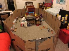 cardboard boxes are stacked on top of each other in the middle of a living room