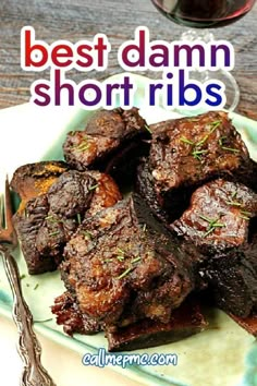 the best damn short ribs recipe is served on a plate with a glass of wine