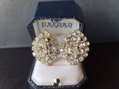 A beautiful pair of vintage clear rhinestone clip-on earrings. Unsigned. All stones are intact. In good vintage condition. A few light surface scratches. A few stones are a little cloudy. No major flaws or issues. Please see photos. Sold as is. Priced accordingly. Will be packaged in a gift box perfect for giving. Some pictures are enlarged to show detail. Does not include any props in photos. Please feel free to contact me with any questions you may have. Before you buy, please note that the it Anniversary Crystal Clip-on Earrings With Sparkling Stones, Anniversary Clip-on Crystal Earrings With Sparkling Stones, Anniversary Clip-on Earrings With Sparkling Crystal Stones, Crystal Clip-on Earrings With Sparkling Stones For Formal Occasions, Glamorous Crystal Clip-on Earrings For Anniversary, Formal Sparkling Crystal Clip-on Earrings, Vintage Cubic Zirconia Earrings For Evening, Vintage Crystal Clip-on Earrings For Wedding, Dazzling Clip-on Earrings With Sparkling Stones For Formal Events