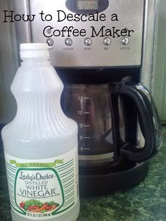 a bottle of coffee sitting next to a blender on a counter with the words how to descale a coffee maker